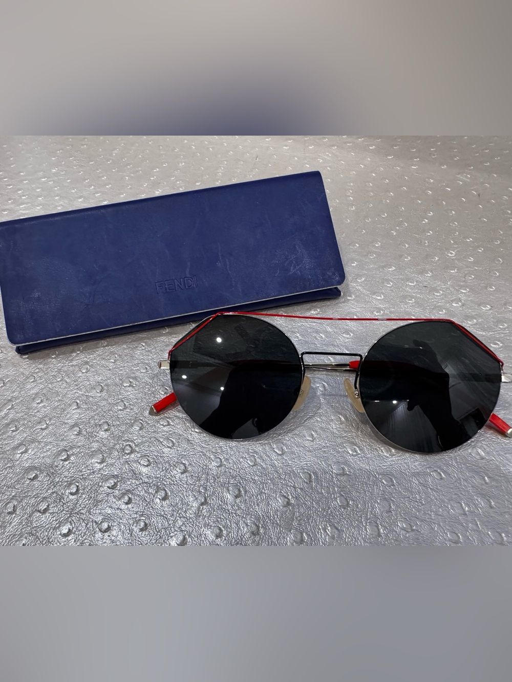 Fendi women’s Round Black Lens Sunglasses with Red Accents